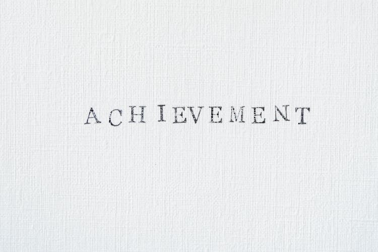 Achievement Text On White Background