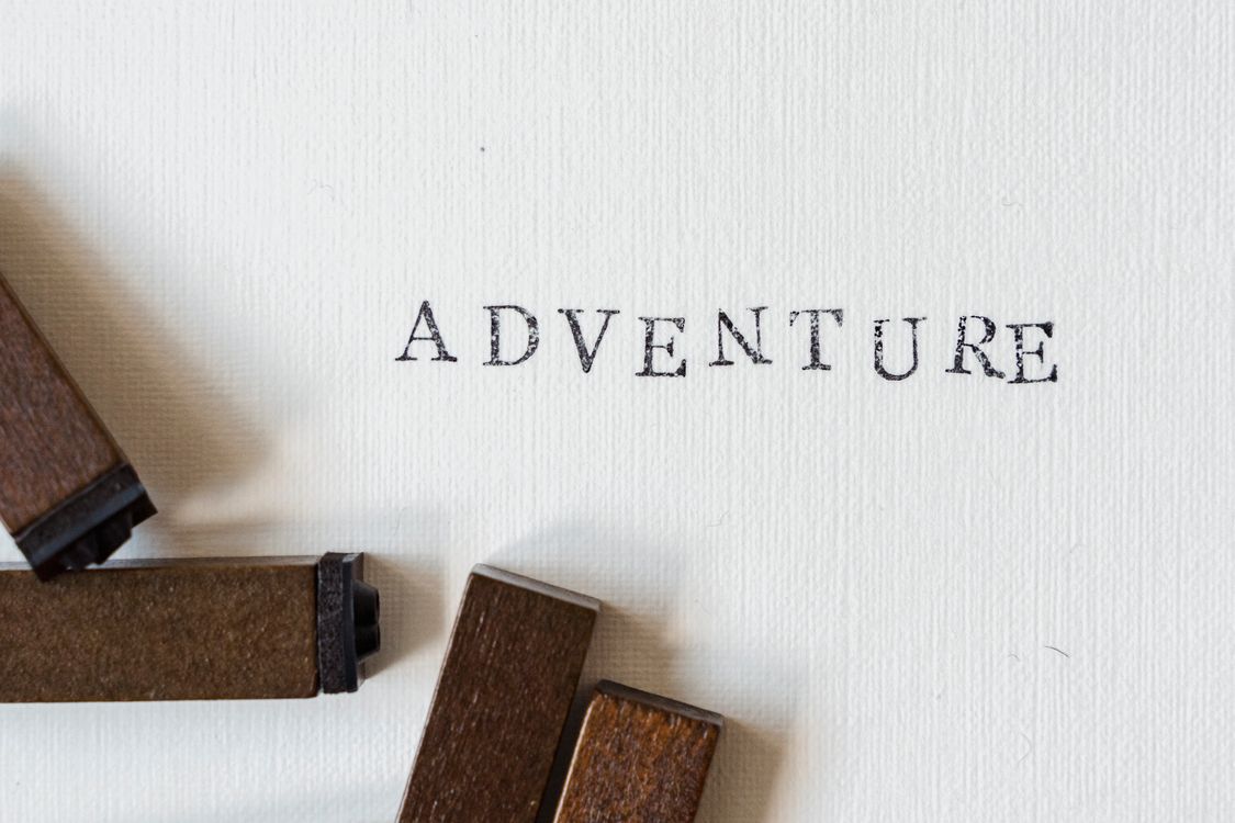 Stamped Lettering Blocks on a White Paper · Free Stock Photo