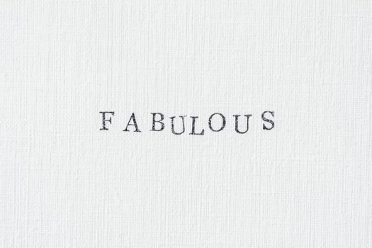Simple textured paper featuring the word 'FABULOUS' in a clean typewriter font.