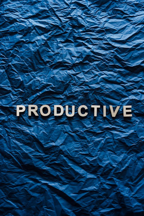 Free The Word Productive on Crumpled Paper Stock Photo