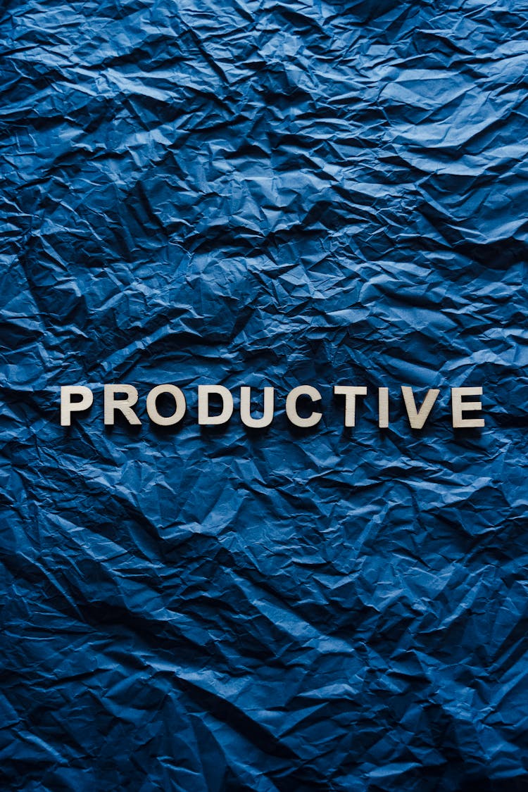 The Word Productive On Crumpled Paper