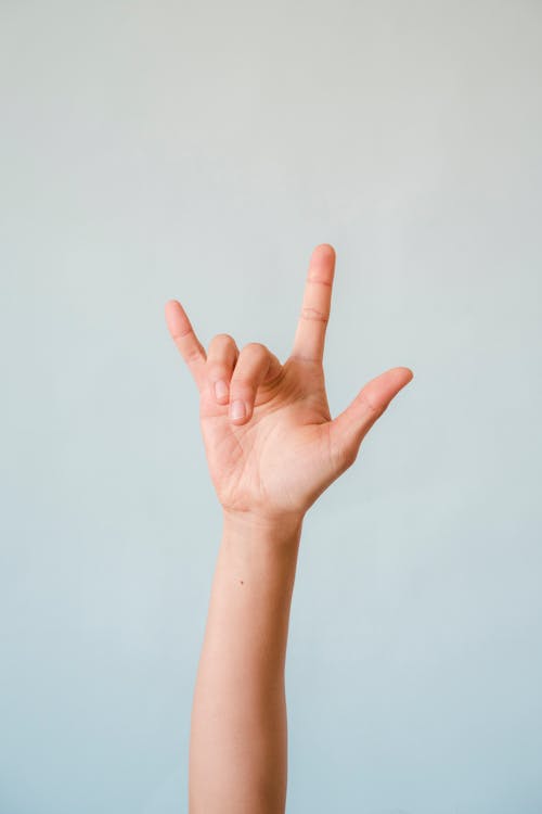 Free A Person Doing the ILY Sign Stock Photo