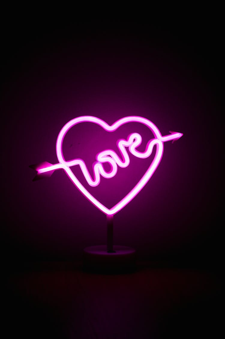 Neon Pink Sign On Black Background