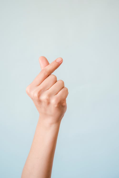 Close-Up Photo of Hand Gesture