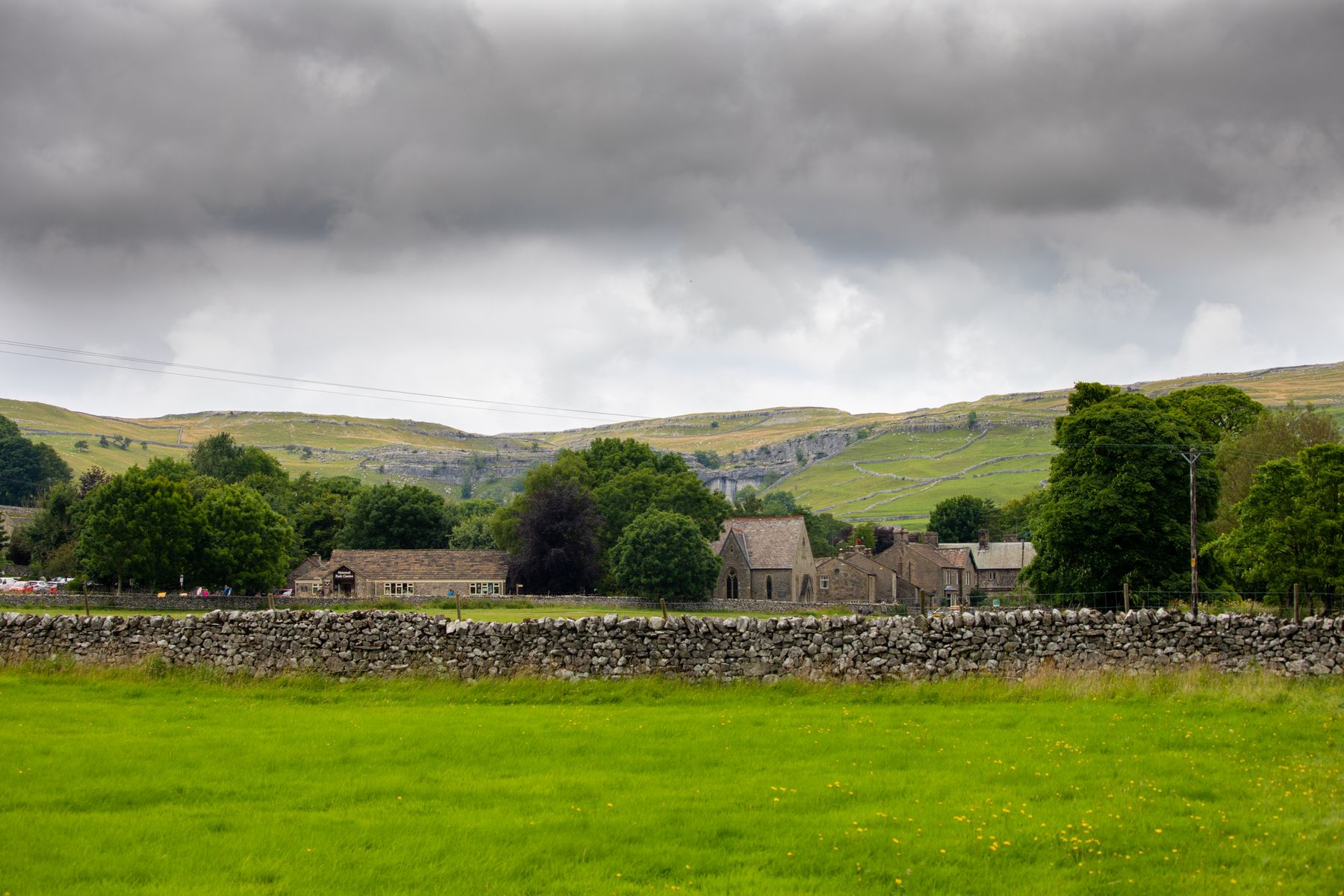 A cosy stone-built pub with an open fire in a Yorkshire Dales village