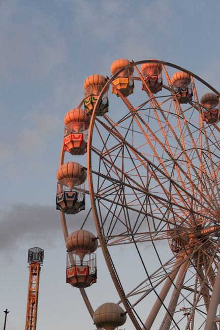 Vibrant Ferris wheel captured at sunset, located in Istanbul, adding a magical touch to the twilight sky.