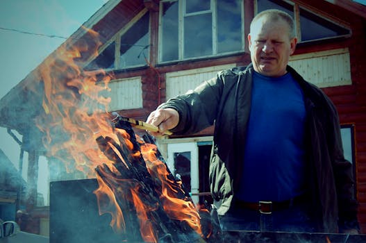 Man in Blue Crew-neck Shirt and Black Leather Jacket Holding Wooden Stick
