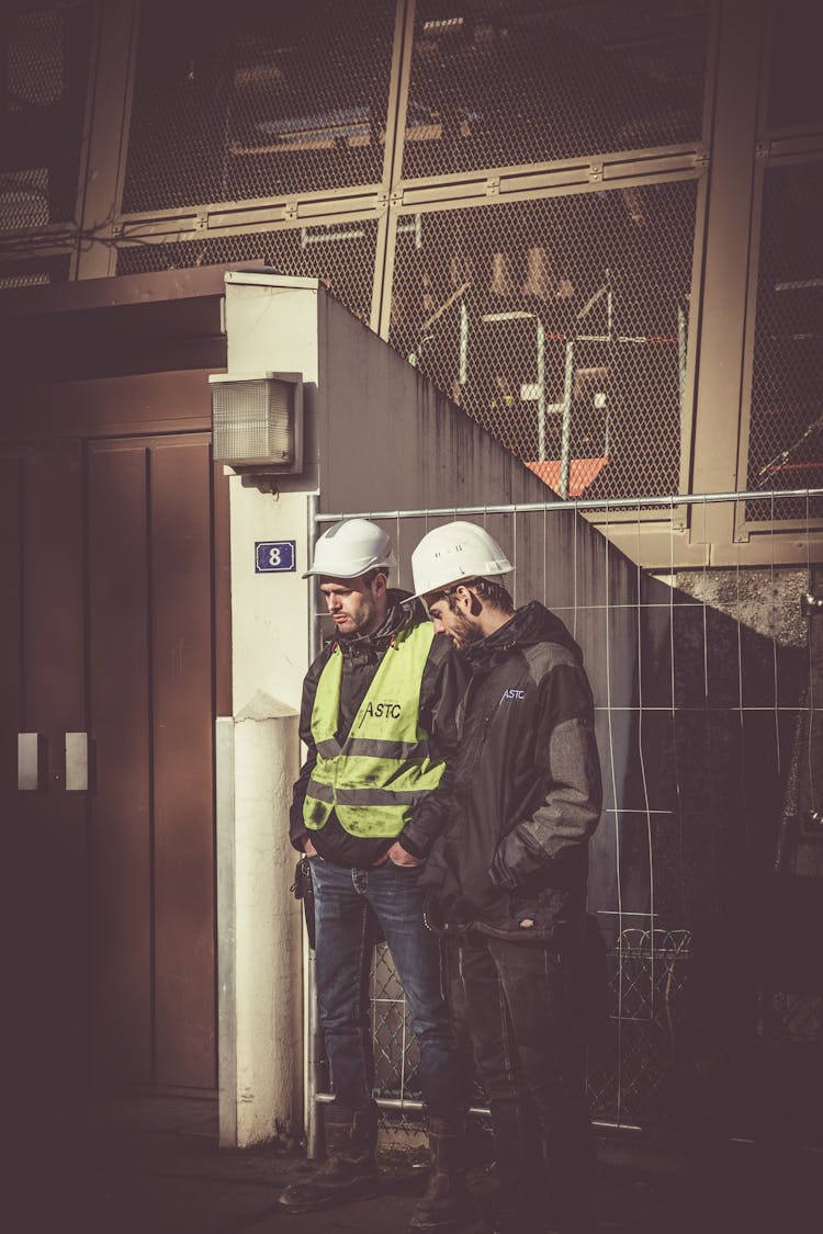 Two Men Wearing White Hard Hat