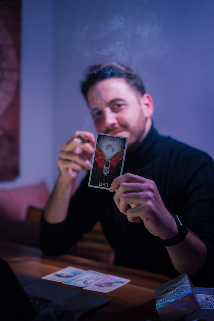 Clairvoyant Man Demonstrating Tarot Card