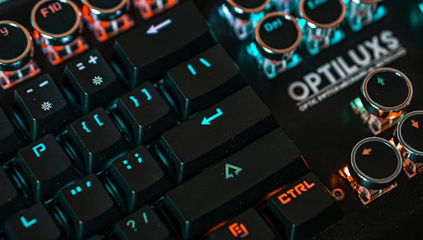 Detailed view of an illuminated mechanical keyboard with Optilux branding.