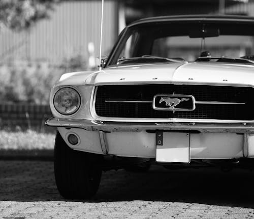 Grayscale Photo of a Vintage Car