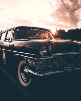 Classic Soviet car captured at sunset in Moscow, showcasing vintage automotive design.