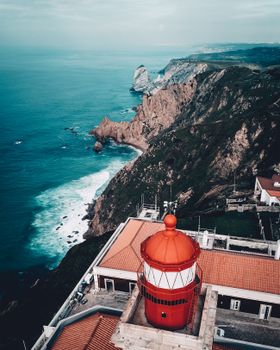 Breathtaking aerial shot of Cabo da Roca lighthouse and coastline in Portugal.