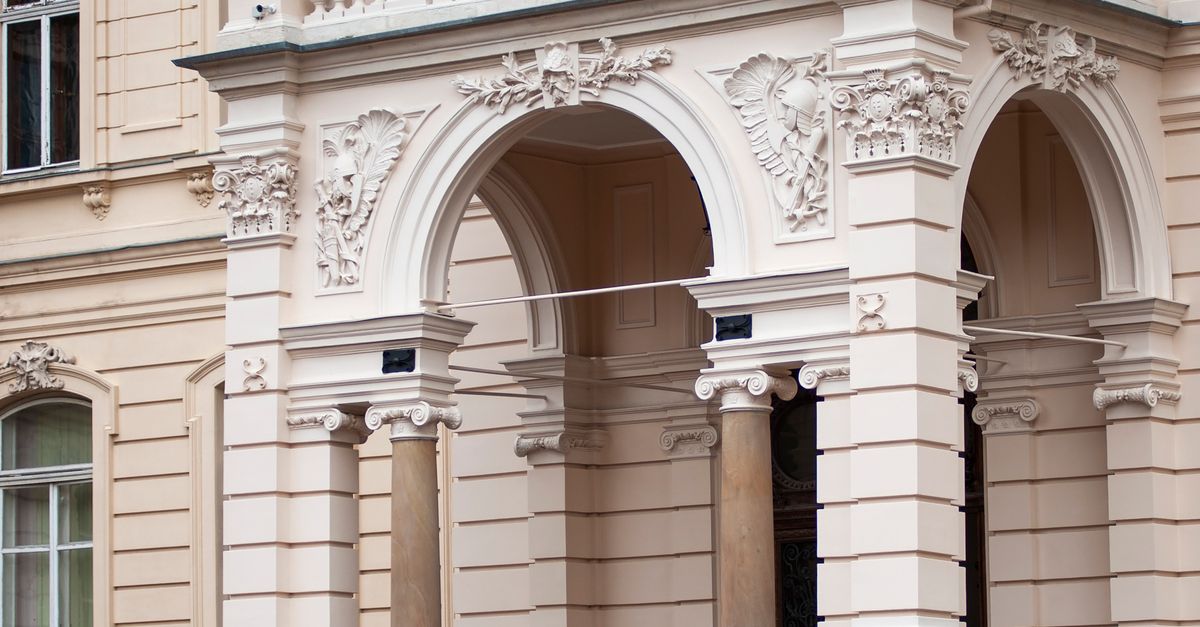 The Entrance of a Beige Building · Free Stock Photo