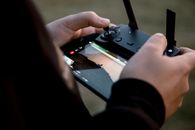 Person Playing Game on Black Dj Controller