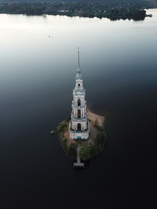 Free Aerial shot of the Kalyazin Bell Tower surrounded by water, captured during the day. Stock Photo