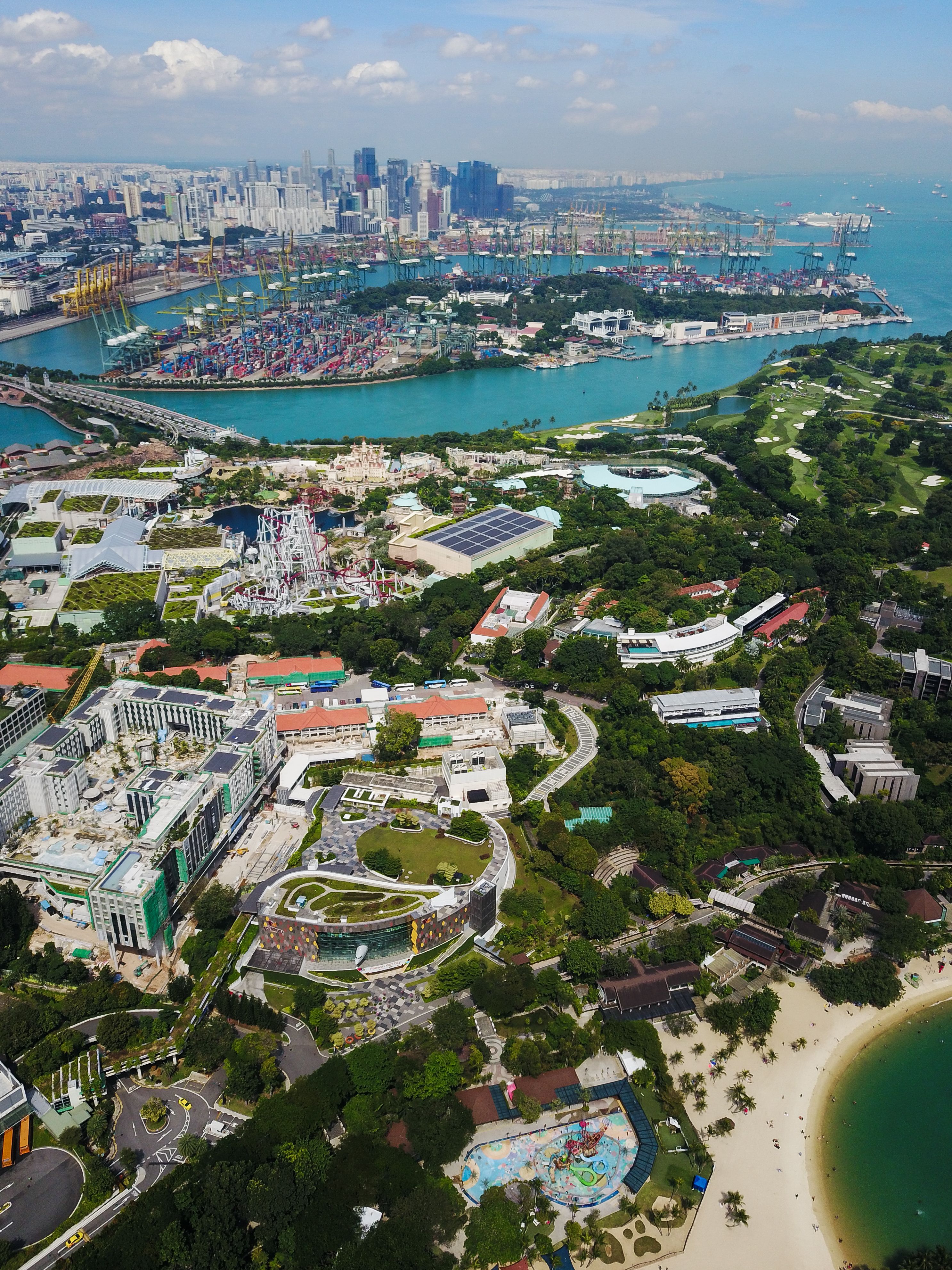 Discover Singapore's urban landscape from above, featuring vibrant cityscapes and lush greenery.