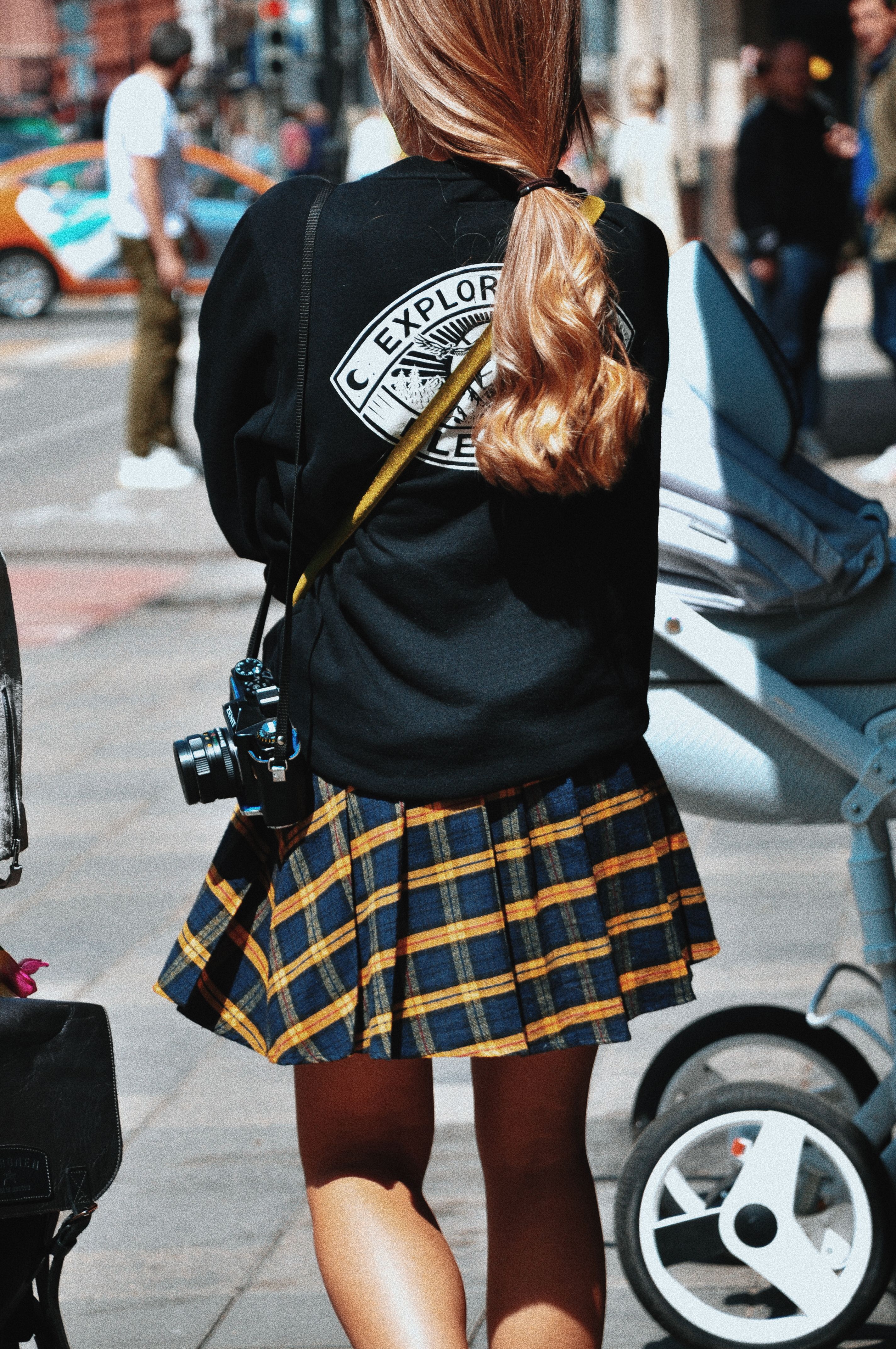 Back View of a Woman Wearing Black Sweater and a Skirt · Free Stock Photo