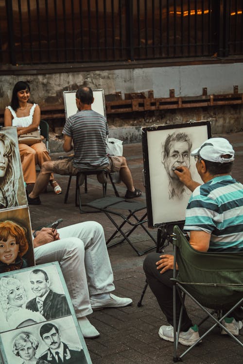 Artists Painting Portraits on Street