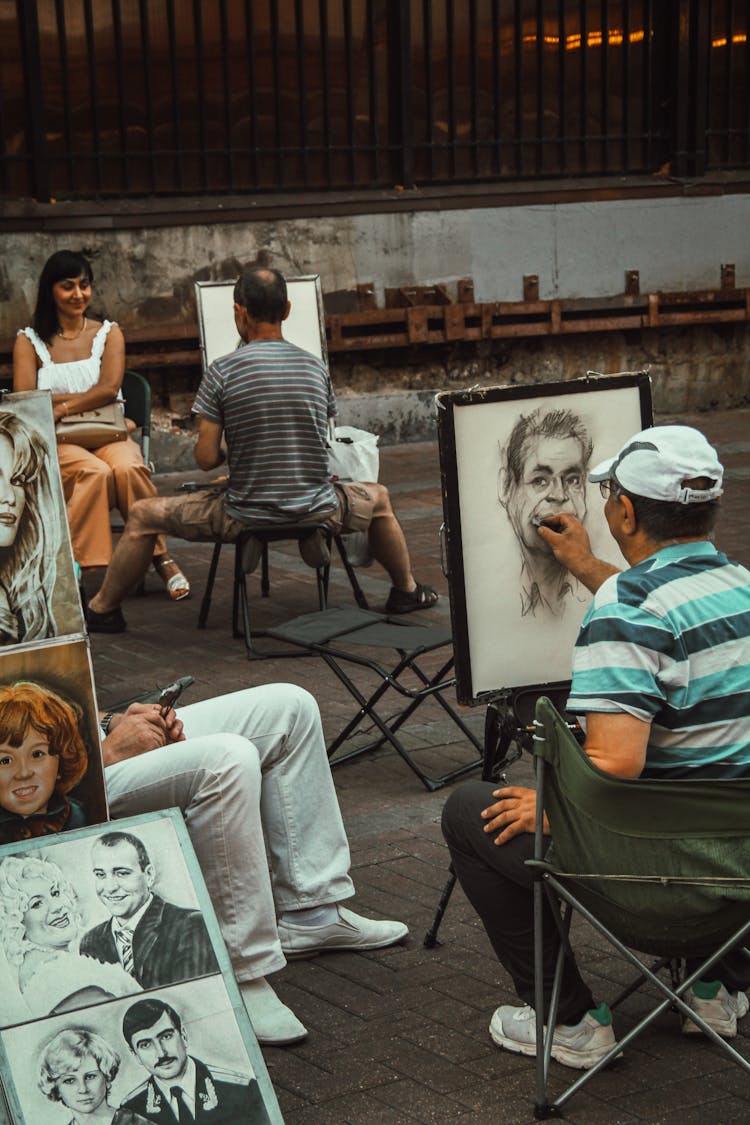 Artists Painting Portraits On Street