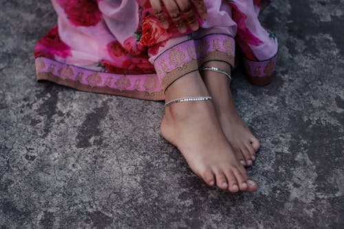 Free Woman's Feet Wearing an Anklet Stock Photo
