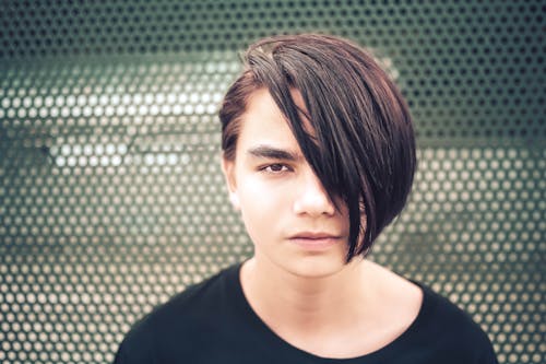 Man in Black Crew Neck T-Shirt With Hair Covering Half of Face