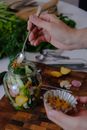 Person Holding Stainless Steel Spoon