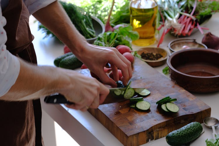 Person Slicing Cucumber