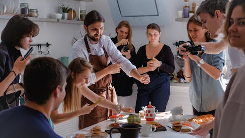 Free People Taking Photo of Food on the Table Stock Photo
