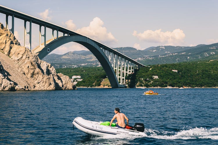 A Man Riding A Speedboat