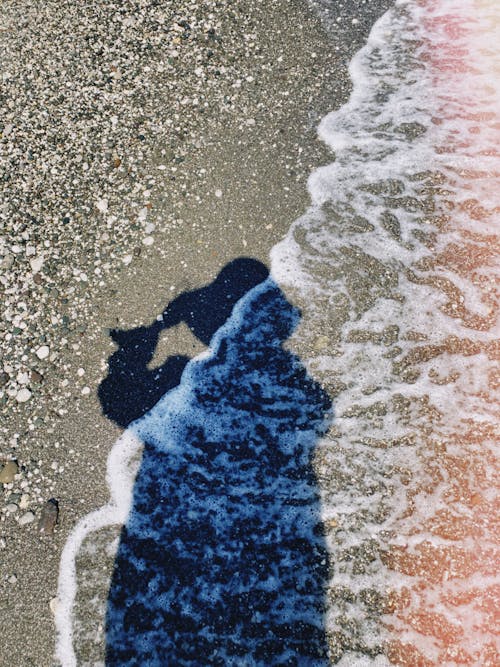 Free Shadow of a Person at the Beach Stock Photo