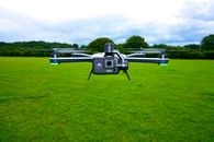 Black and Gray Camera on Green Grass Field
