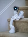 White Ai Robot on the Stairs