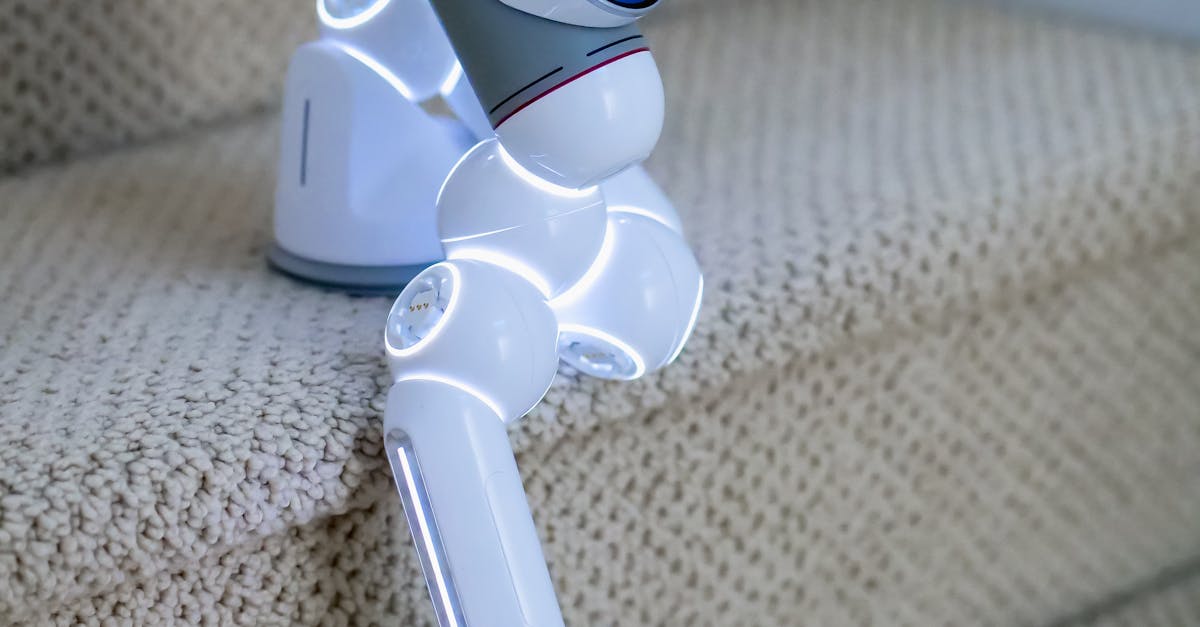 Photo by Kindel Media A futuristic robot climbing stairs showcasing advanced technology and innovation indoors.