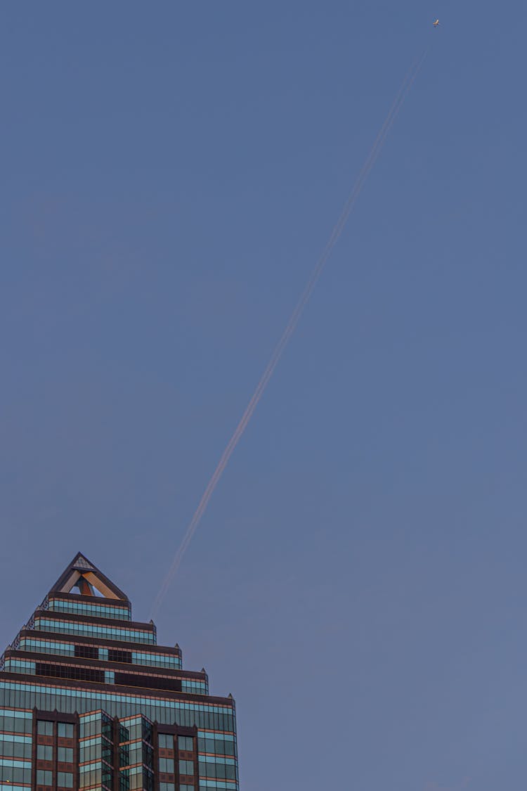 Jet Smoke Trail In The Blue Sky