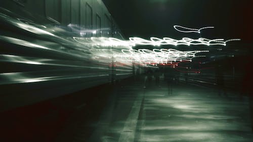 Free White Lights in Motion on Railway Platform Stock Photo