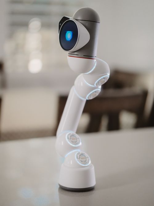 Free Modern robotic arm with blue sensor, showcasing futuristic technology indoors. Stock Photo