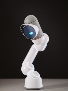 Photo by Kindel Media A sleek, modern robotic arm with illuminated features in a professional studio setting.