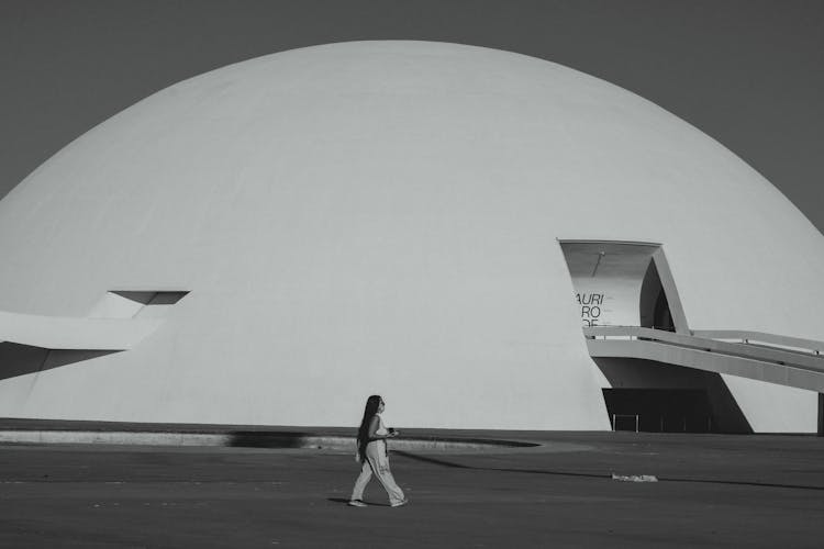 A Woman Walking In The Grounds Of National Museum Of The Republic In Brazil