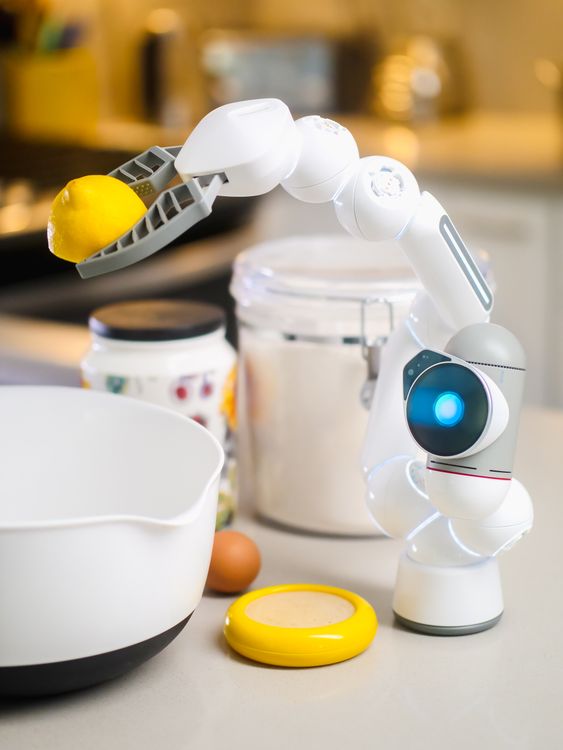 Lemonade Robot White Robot holding a Lemon · Free Stock Photo