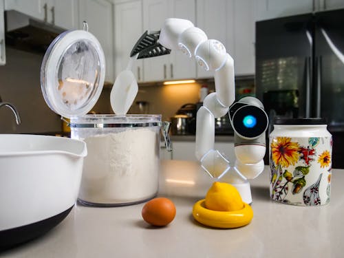 Free White Toy Robot with a Scoop Stock Photo
