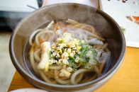 Noodle Soup With Sliced Vegetables in Black Ceramic Bowl
