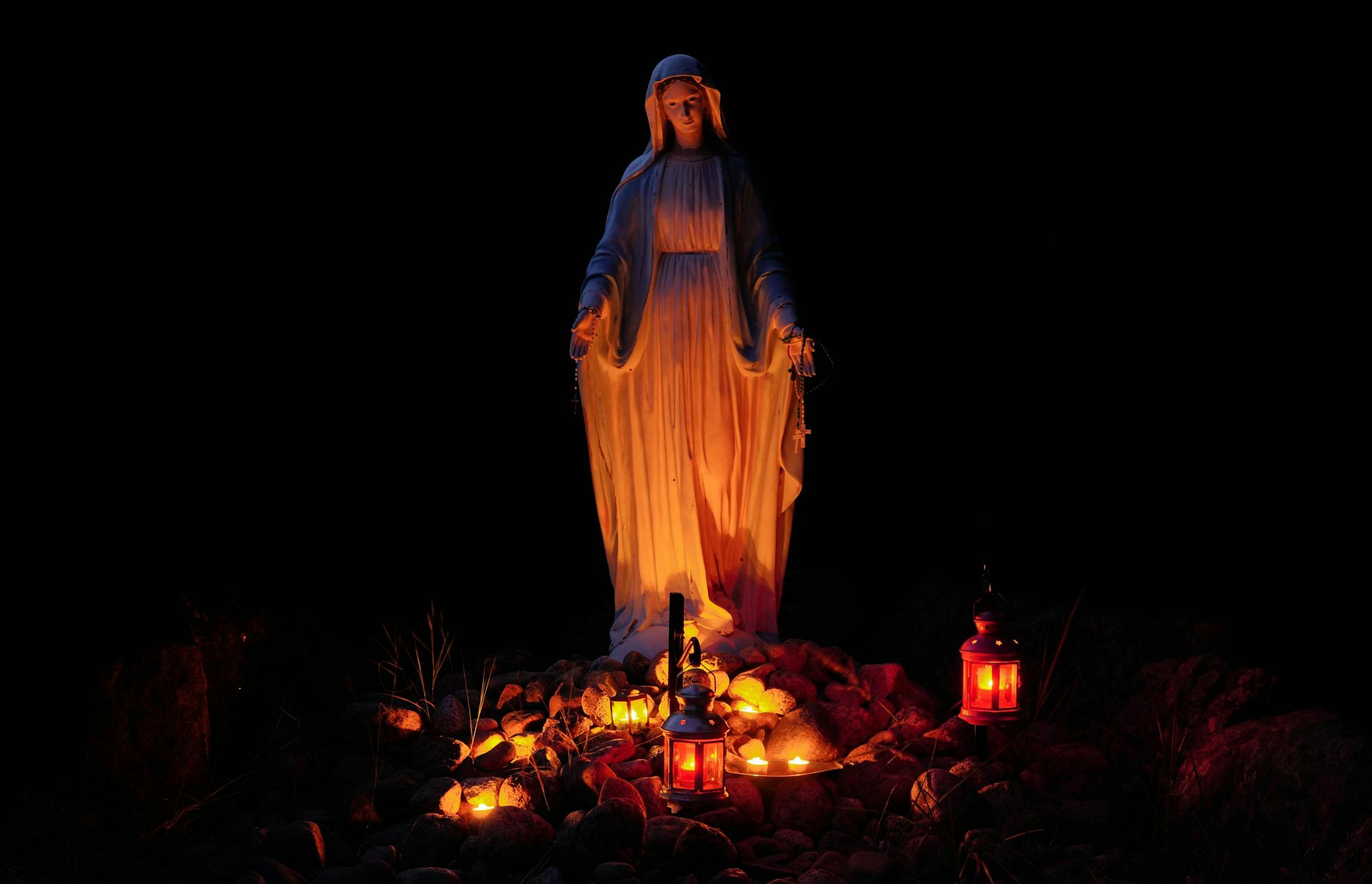 Statue of a Virgin Mary Lighted by Candles · Free Stock Photo