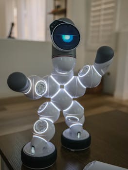 Modern walking robot with LED lights standing on a wooden surface indoors. Shallow focus emphasizes its futuristic design.