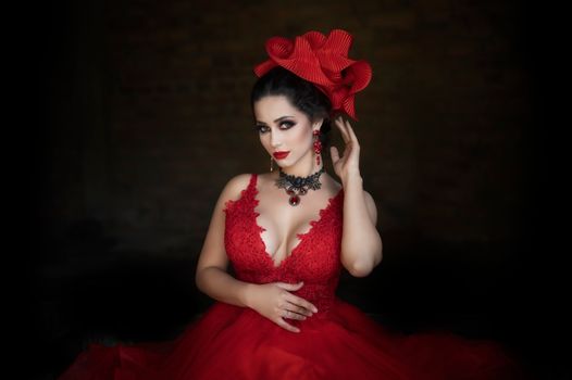 A Woman in Red Dress and Red Headdress