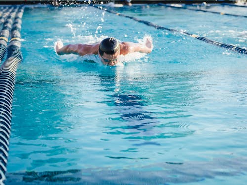 A Person Swimming in a Swimming Pool