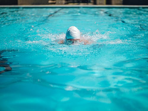 Person Swimming in the Pool