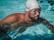 Man in Swimming Goggles in Water