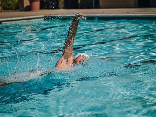 A Swimmer Swimming Freestyle in the Pool