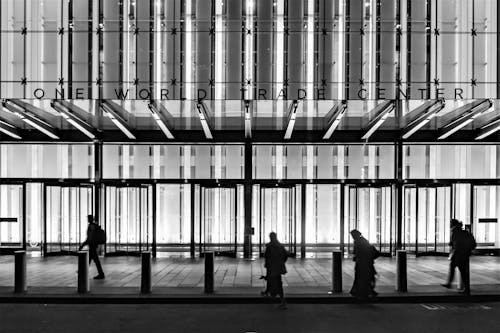 Silhouette of People in Front of a Building